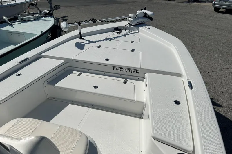 Slide: The Image of 2020 Frontier 2104 CC boat deck with storage compartments and seating. - 4