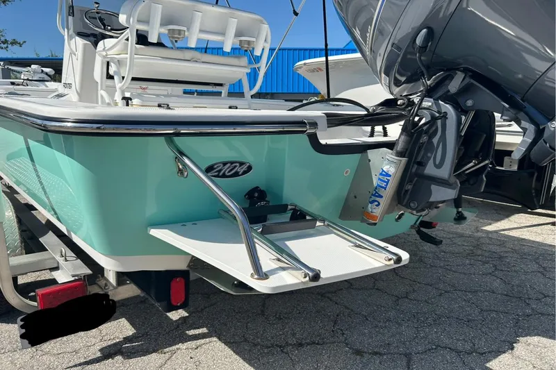 Slide: The Image of 2020 Frontier 2104 CC boat with outboard motor and swim platform. - 9