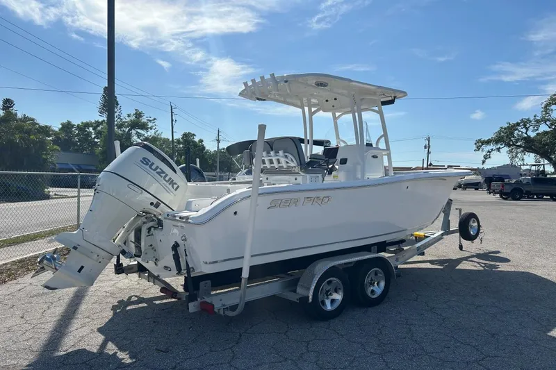 Slide: The Image of 2021 Sea Pro 219 Deep-V boat on trailer with Suzuki outboard motor. - 13