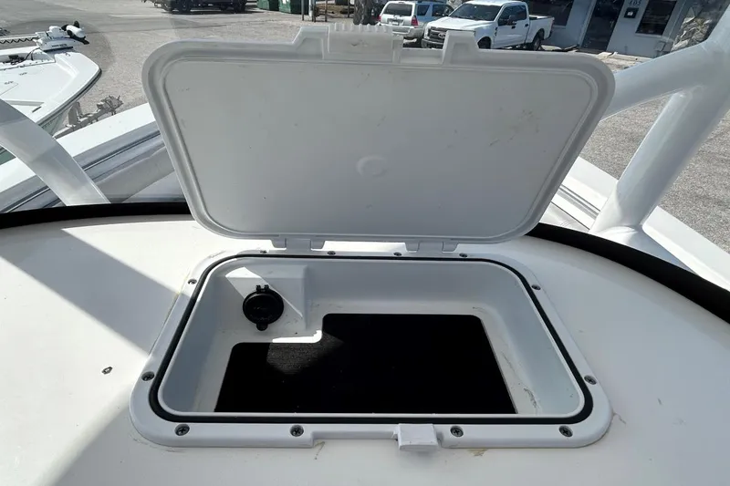 Slide: The Image of Open storage compartment on 2021 Sea Pro 219 Deep-V boat, showing interior details. - 22