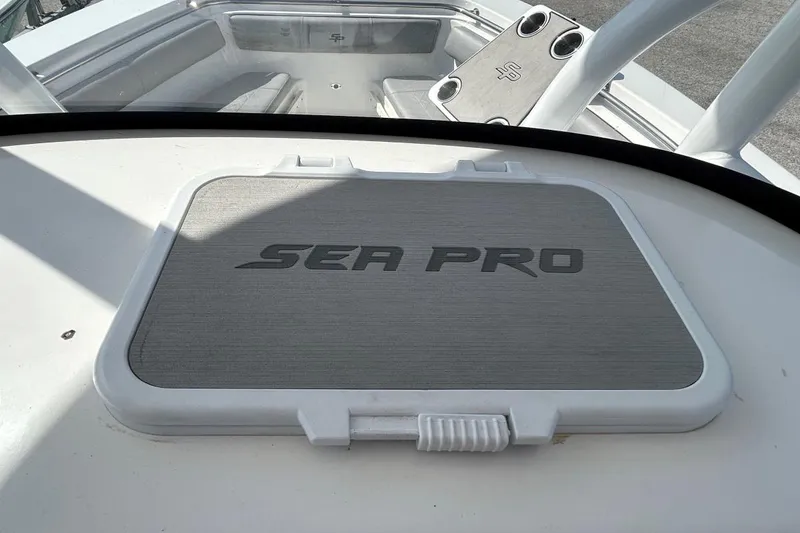 Slide: The Image of 2021 Sea Pro 219 Deep-V boat interior with logo on hatch cover. - 23