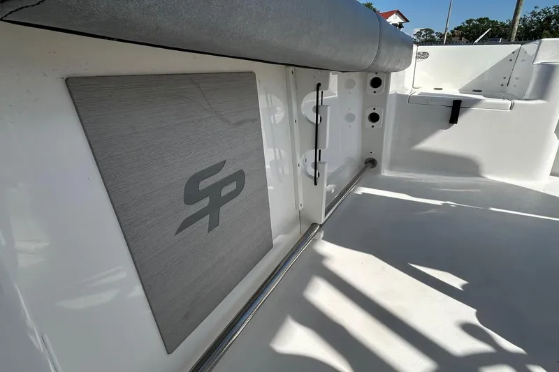 Slide: The Image of 2021 Sea Pro 219 Deep-V boat interior with logo and seating area. - 24