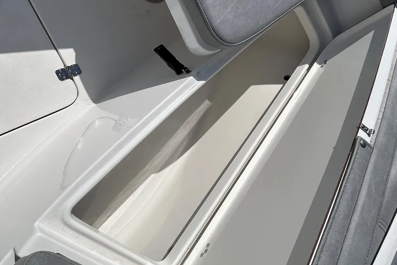 Slide: The Image of Open storage compartment on 2021 Sea Pro 219 Deep-V boat, showcasing spacious interior. - 20