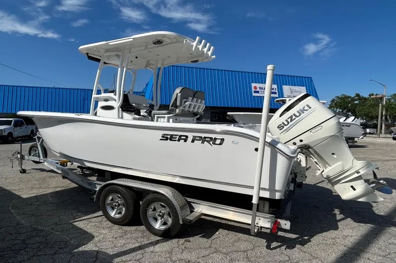 Slide: The Image of 2021 Sea Pro 219 Deep-V boat with Suzuki outboard motor on a trailer. - 23