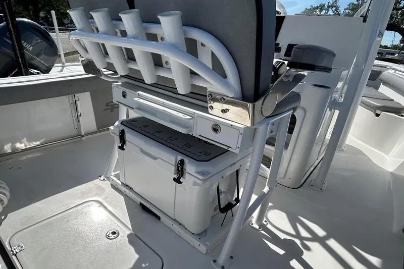 Slide: The Image of 2021 Sea Pro 219 Deep-V boat interior with rod holders and storage. - 6