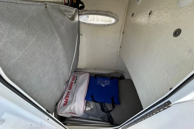 Slide: The Image of Interior storage of 2021 Sea Pro 219 Deep-V boat with safety gear bag and equipment. - 9