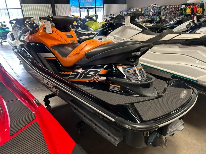 Slide: The Image of 2019 Kawasaki Ultra 310X jet ski with orange seat in showroom display. - 3