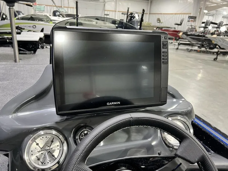 Slide: The Image of Dashboard of 2025 Phoenix 920 Elite boat with Garmin display and gauges. - 22