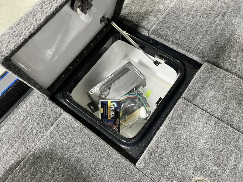 Slide: The Image of Storage compartment in 2025 Phoenix 920 Elite boat with Garmin equipment. - 24