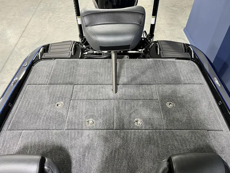 Slide: The Image of 2025 Phoenix 920 Elite boat deck with gray carpet and seating. - 25