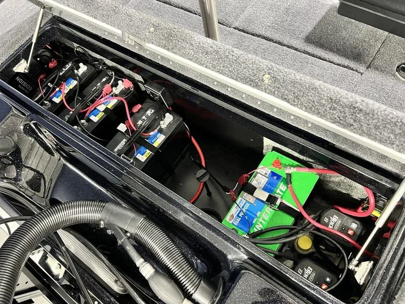 Slide: The Image of Battery compartment of 2025 Phoenix 920 Elite boat, showcasing multiple connected batteries. - 28
