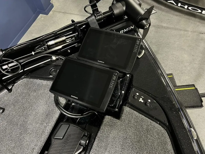 Slide: The Image of 2025 Phoenix 920 Elite boat dashboard with dual Garmin displays and advanced controls. - 6