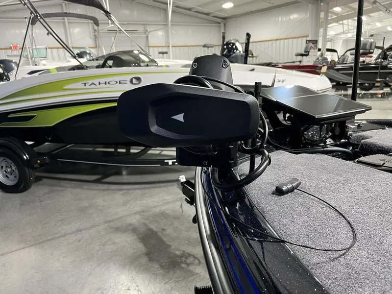 Slide: The Image of 2025 Phoenix 920 Elite boat in showroom, featuring advanced equipment and sleek design. - 9