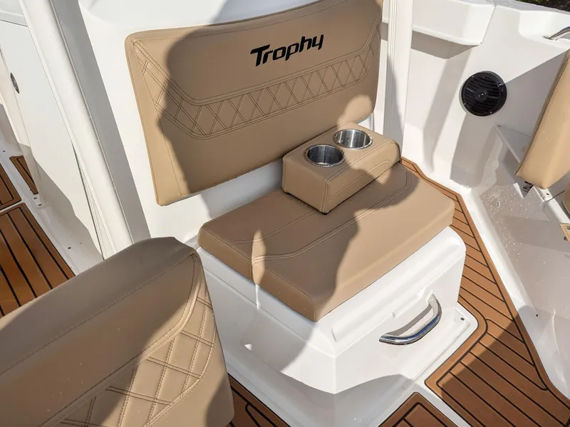 Slide: The Image of 2025 Bayliner Trophy T20CC boat seat with cup holders and teak flooring. - 11