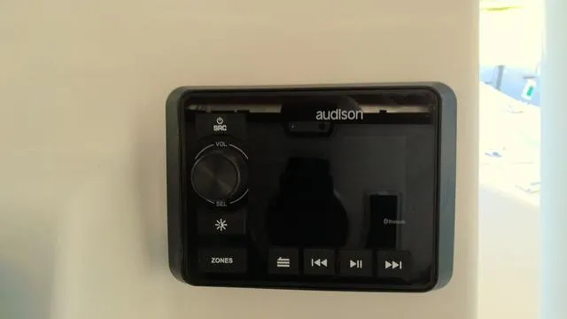 Slide: The Image of Audison audio control panel on 2025 Sea Pro 210 Bay boat. - 12