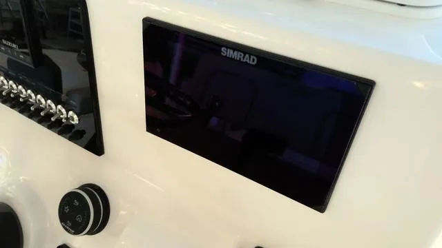Slide: The Image of Simrad display on 2025 Sea Pro 210 Bay boat dashboard. - 13