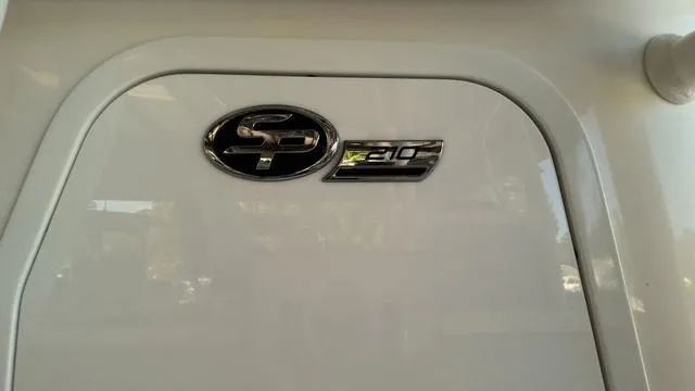 Slide: The Image of 2025 Sea Pro 210 Bay boat emblem on white surface. - 4