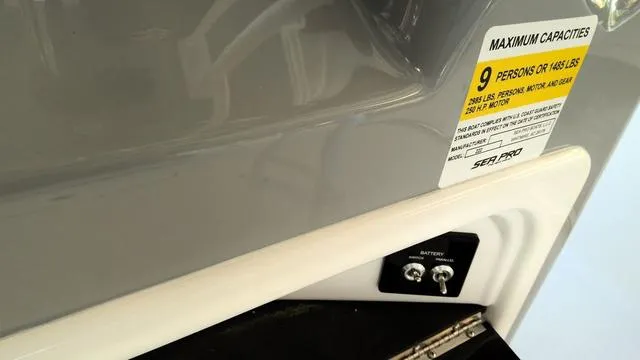 Slide: The Image of 2025 Sea Pro 222 Center Console capacity label, showing 9-person limit and battery switch. - 15