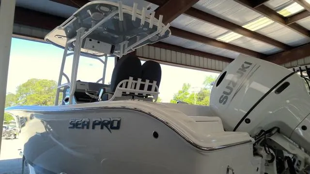 Slide: The Image of 2025 Sea Pro 222 Center Console boat with Suzuki engine in a covered storage area. - 21