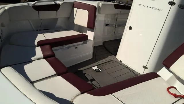 Slide: The Image of 2019 Tahoe 2150 CC boat interior with white and maroon seating. - 4