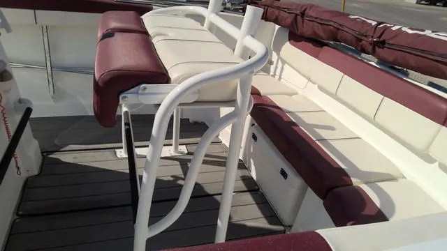 Slide: The Image of 2019 Tahoe 2150 CC boat interior with maroon and white seating. - 6