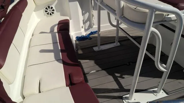 Slide: The Image of 2019 Tahoe 2150 CC boat interior with maroon and white seating. - 9