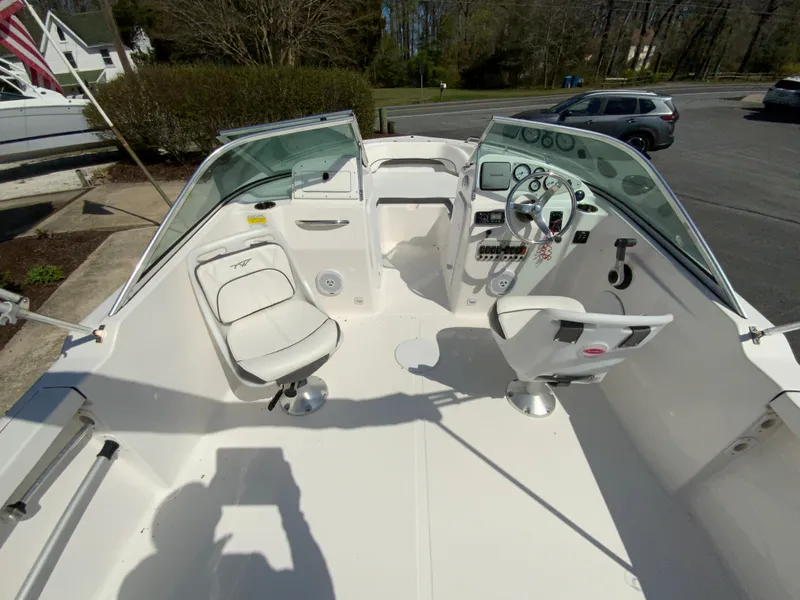 Slide: The Image of 2015 Tidewater 196 DC Explorer boat interior with dual console seating and steering wheel. - 11