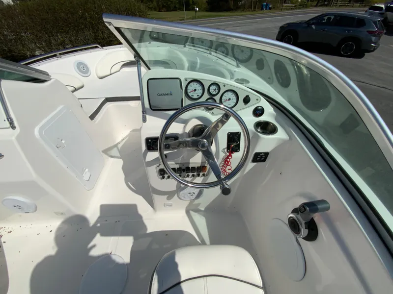 Slide: The Image of Cockpit of 2015 Tidewater 196 DC Explorer boat with steering wheel and gauges. - 12