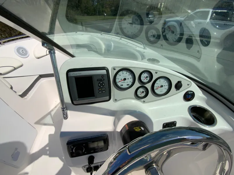 Slide: The Image of 2015 Tidewater 196 DC Explorer dashboard with gauges and steering wheel. - 13