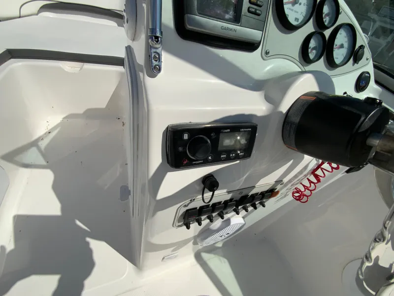 Slide: The Image of Control panel of 2015 Tidewater 196 DC Explorer boat with gauges and switches. - 14