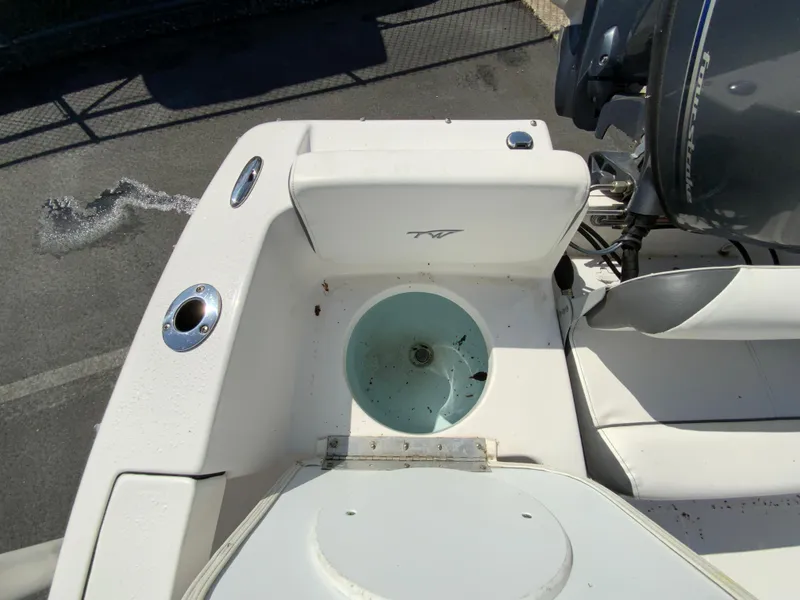 Slide: The Image of 2015 Tidewater 196 DC Explorer boat interior with livewell and seating area. - 19