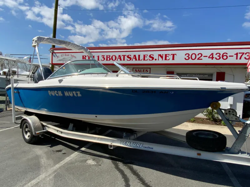 Slide: The Image of 2015 Tidewater 196 DC Explorer boat on trailer at dealership. - 2