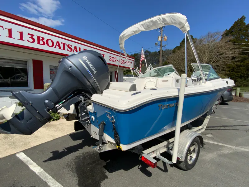 Slide: The Image of 2015 Tidewater 196 DC Explorer boat with Yamaha motor on trailer, parked outside dealership. - 9