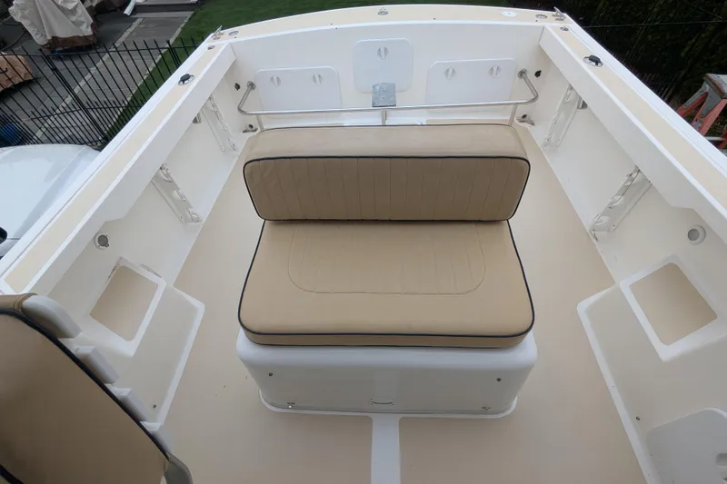 Slide: The Image of 2004 Hunt Yachts Surfhunter 25 interior with beige seating and spacious deck. - 20