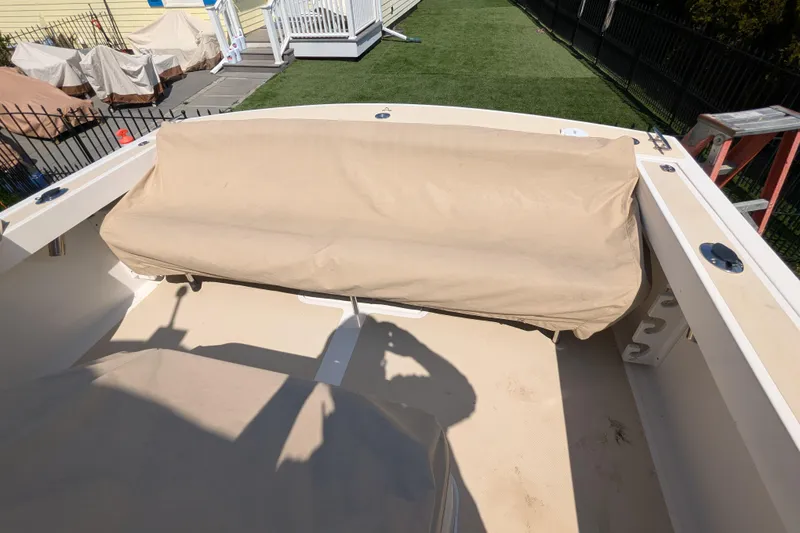 Slide: The Image of 2004 Hunt Yachts Surfhunter 25 with covered seating area on deck. - 22