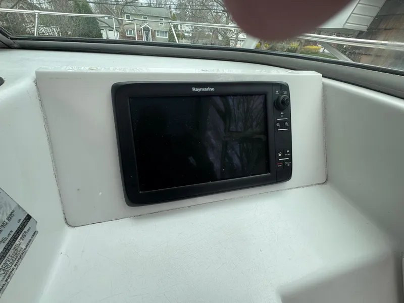 Slide: The Image of Raymarine display on 2000 Seaswirl Striper WALKAROUND boat dashboard. - 23