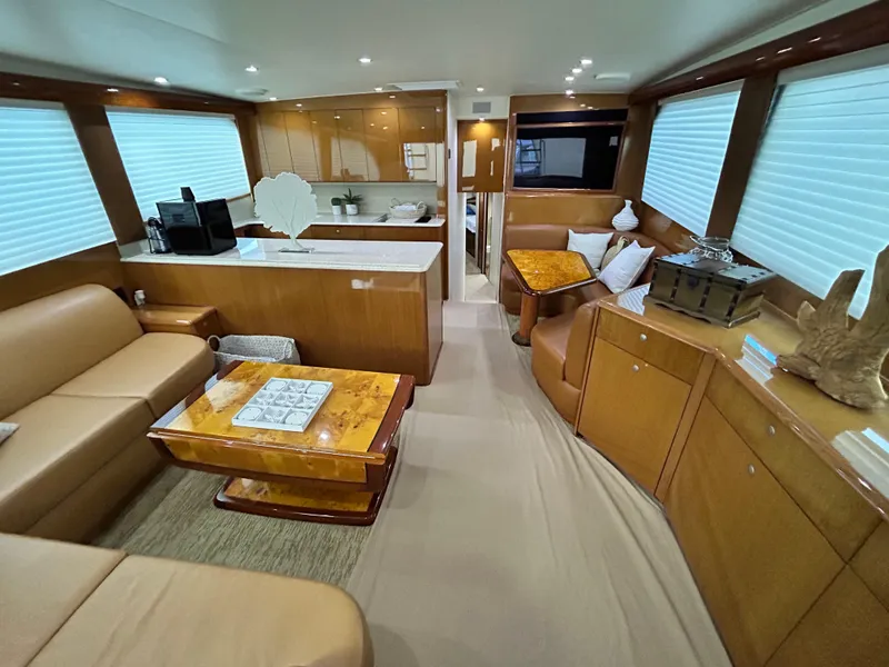 Slide: The Image of Luxurious interior of a 2001 Viking 55 Convertible yacht with elegant wood finishes. - 1