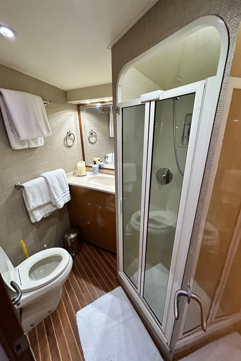 Slide: The Image of Bathroom interior of 2001 Viking 55 Convertible yacht with shower and toilet. - 11