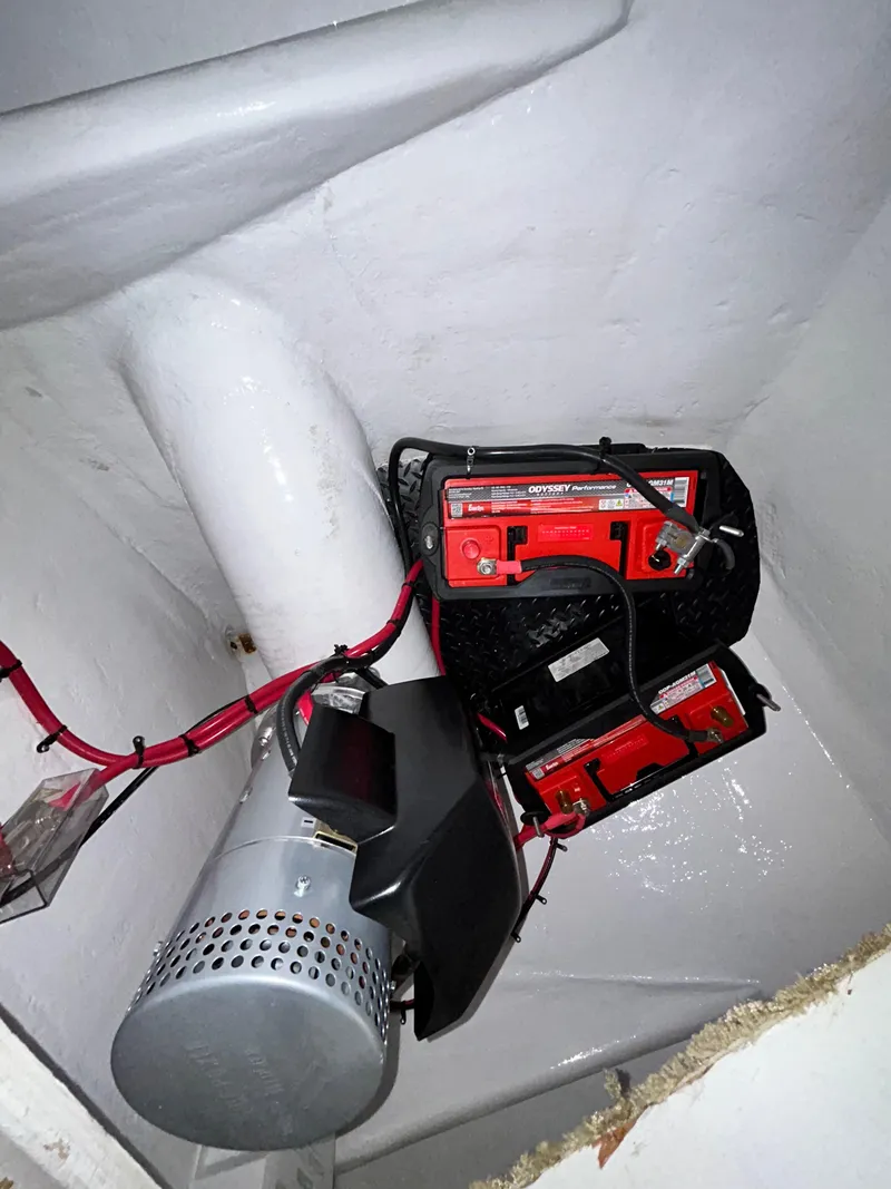 Slide: The Image of Battery compartment of a 2001 Viking 55 Convertible boat with red wiring. - 14