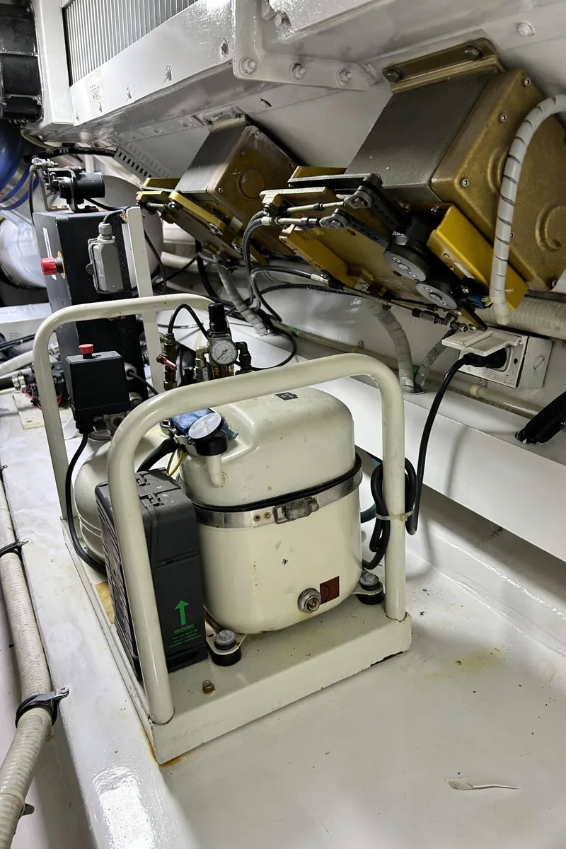 Slide: The Image of Engine room of 2001 Viking 55 Convertible yacht, showcasing mechanical components. - 19