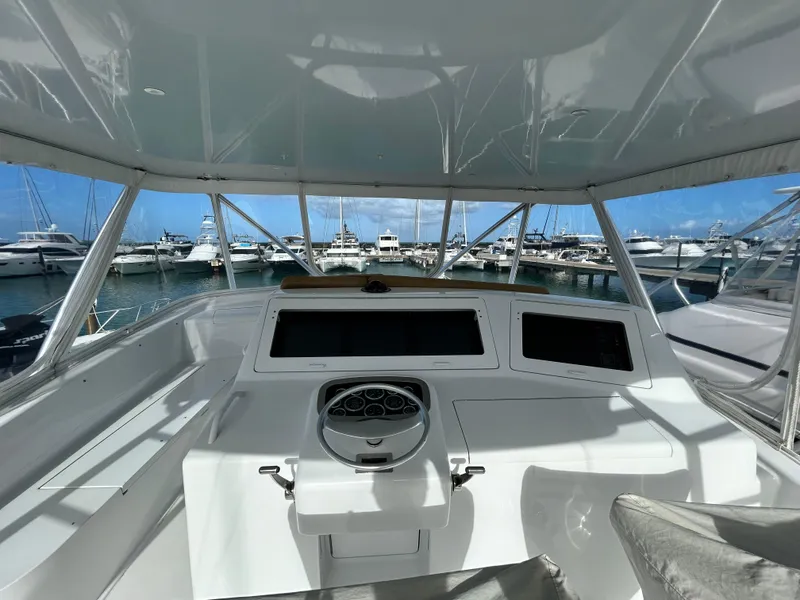Slide: The Image of 2001 Viking 55 Convertible yacht helm with marina view. - 24