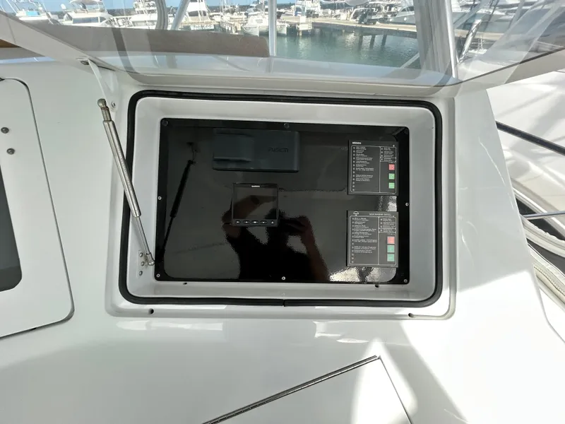 Slide: The Image of Control panel on a 2001 Viking 55 Convertible yacht, docked at a marina. - 26