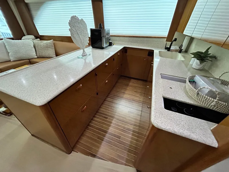 Slide: The Image of Luxurious kitchen interior of 2001 Viking 55 Convertible yacht with modern amenities. - 5