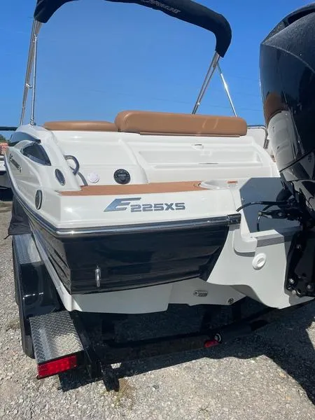 Slide: The Image of 2023 Crownline E225 XS boat, rear view, on trailer, sunny day. - 3