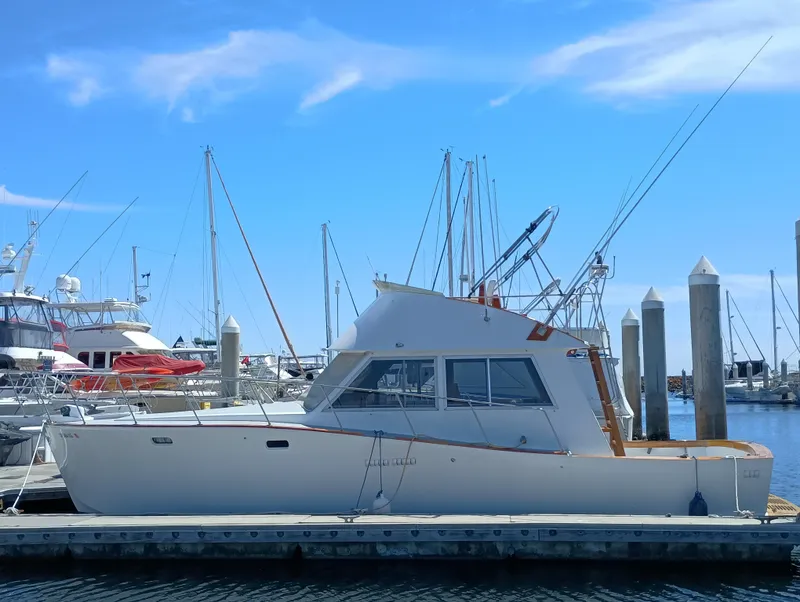 The Image of 1978 Pacific Bluefin SPF boat docked at marina under clear blue sky. - 0
