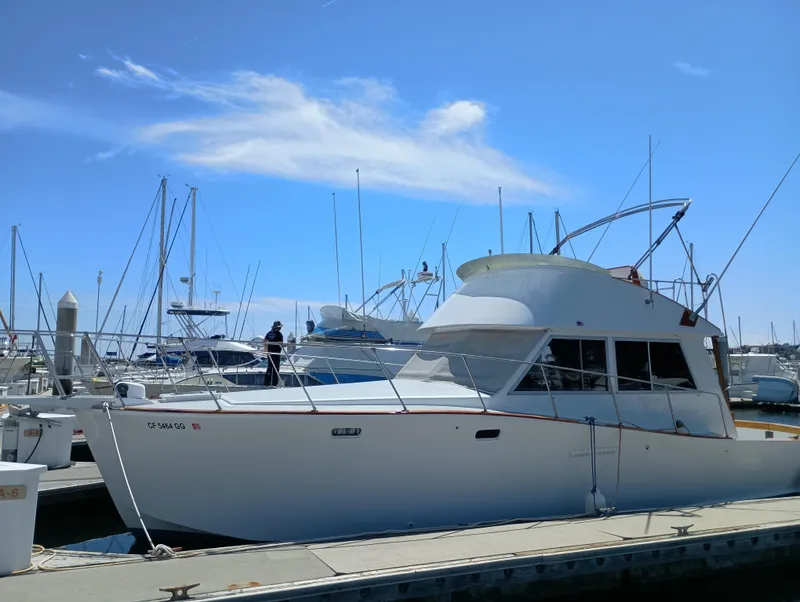 Slide: The Image of 1978 Pacific Bluefin SPF boat docked at marina under clear blue sky. - 2
