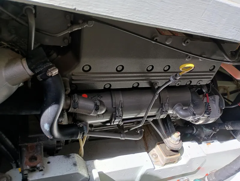 Slide: The Image of Engine compartment of a 1978 Pacific Bluefin SPF boat, showing hoses and components. - 32