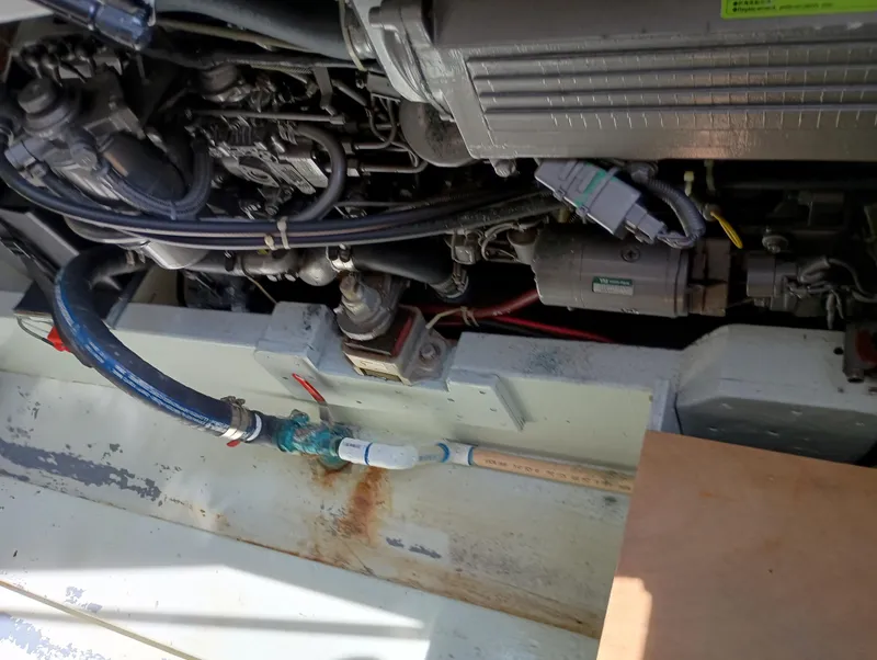 Slide: The Image of Engine compartment of a 1978 Pacific Bluefin SPF with visible hoses and components. - 34