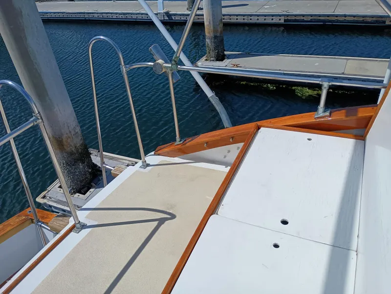 Slide: The Image of 1978 Pacific Bluefin SPF boat deck with wooden trim, docked at marina. - 42
