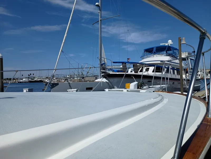 Slide: The Image of 1978 Pacific Bluefin SPF boat docked at marina under clear blue sky. - 45